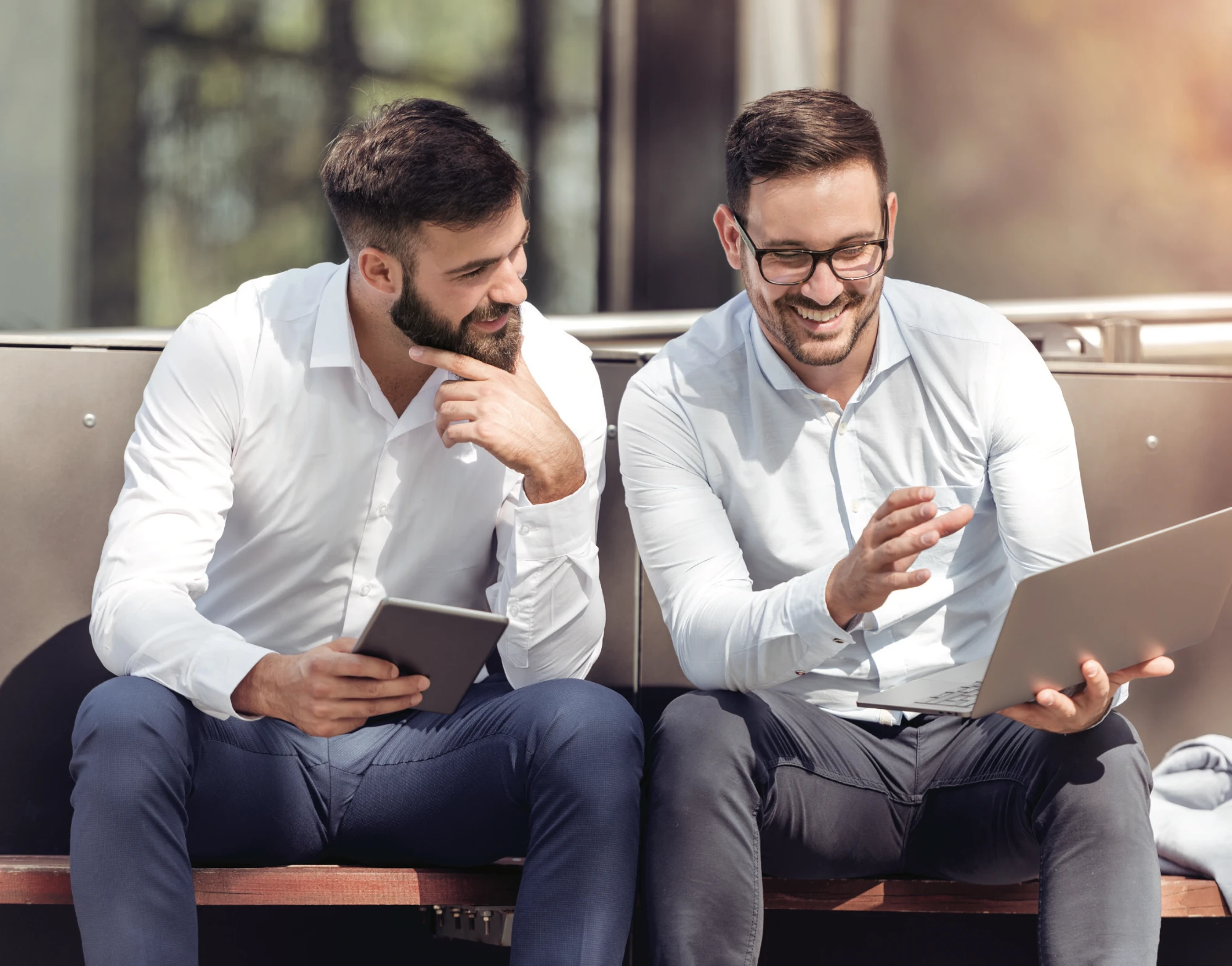 Two businessman looking at a laptop